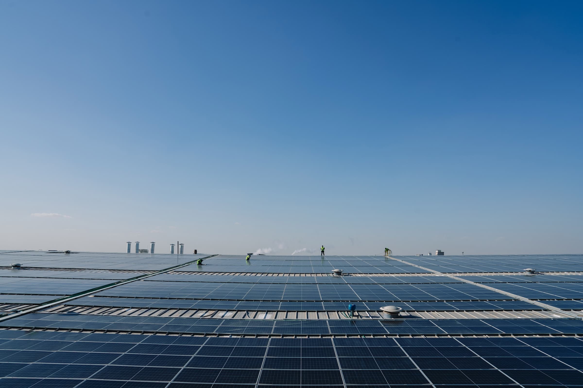 Rooftop solar array under a clear sky